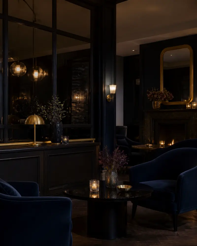 Intimate boutique hotel lounge dark velvet polished wood